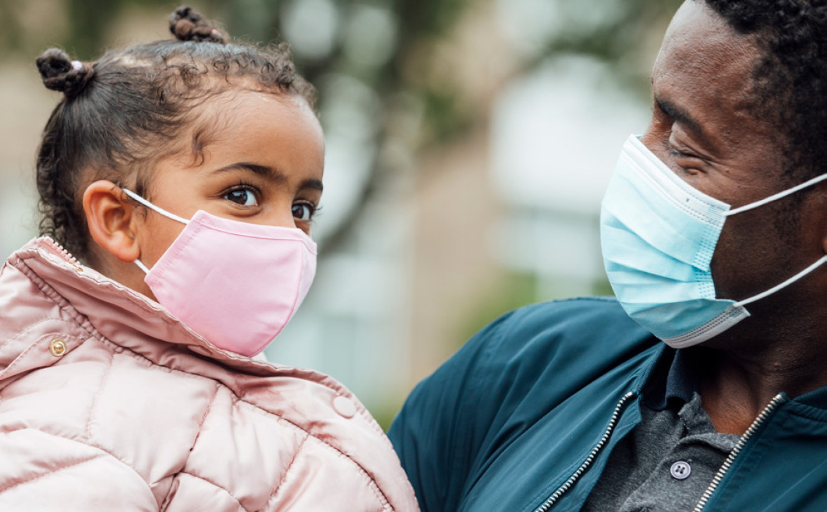 Father and daughter with masks on